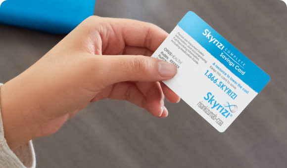 Hand holding a Skyrizi Complete Savings Card