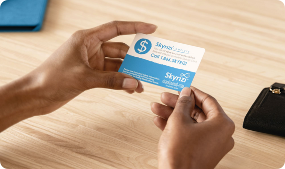 Hand holding a Skyrizi Complete Savings Card 