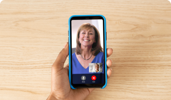 Hand Holding Phone and Video Chatting with a SKYRIZI Nurse Ambassador