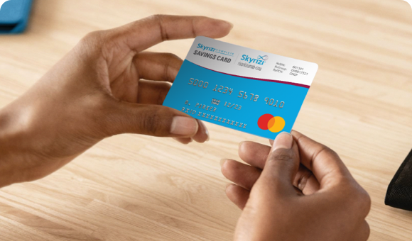 Hand holding a Skyrizi Complete Savings Card