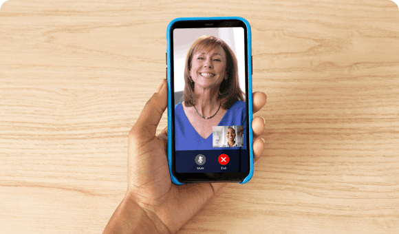 Hand Holding Phone and Video Chatting with a SKYRIZI Nurse Ambassador